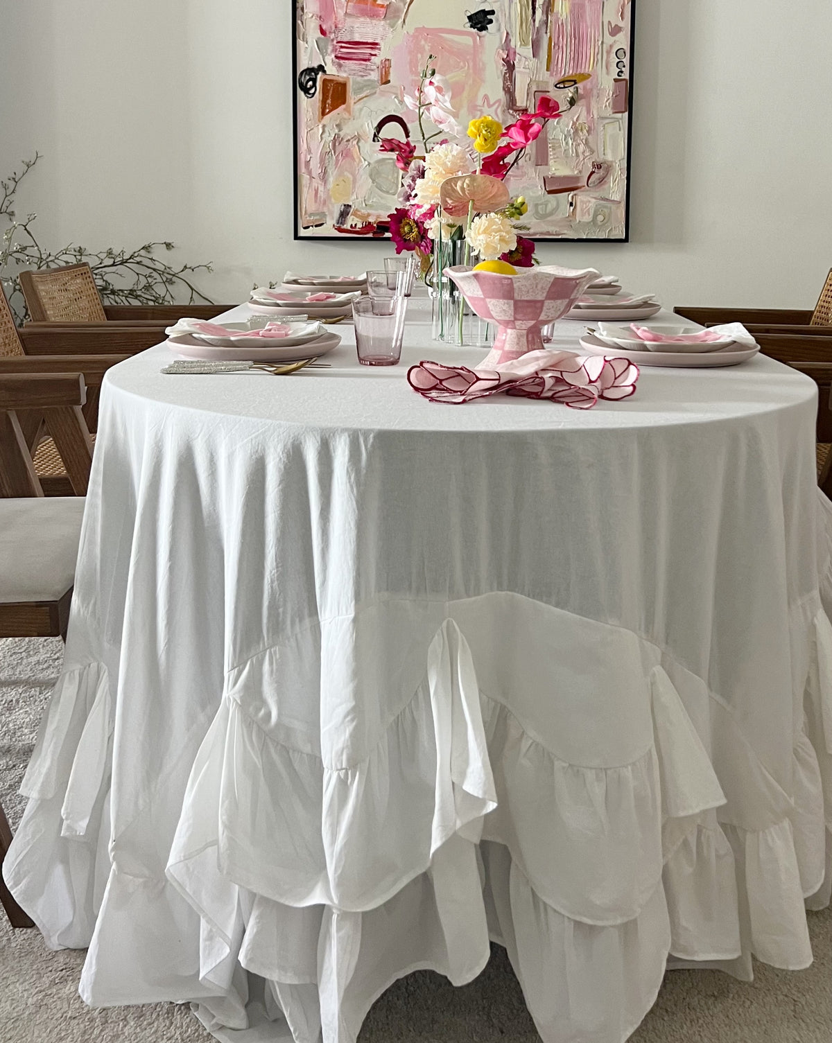 Allegria white Amélie Scalloped Edge Tablecloth showing the deep gathered ruffle skirt drape on a rectangular table