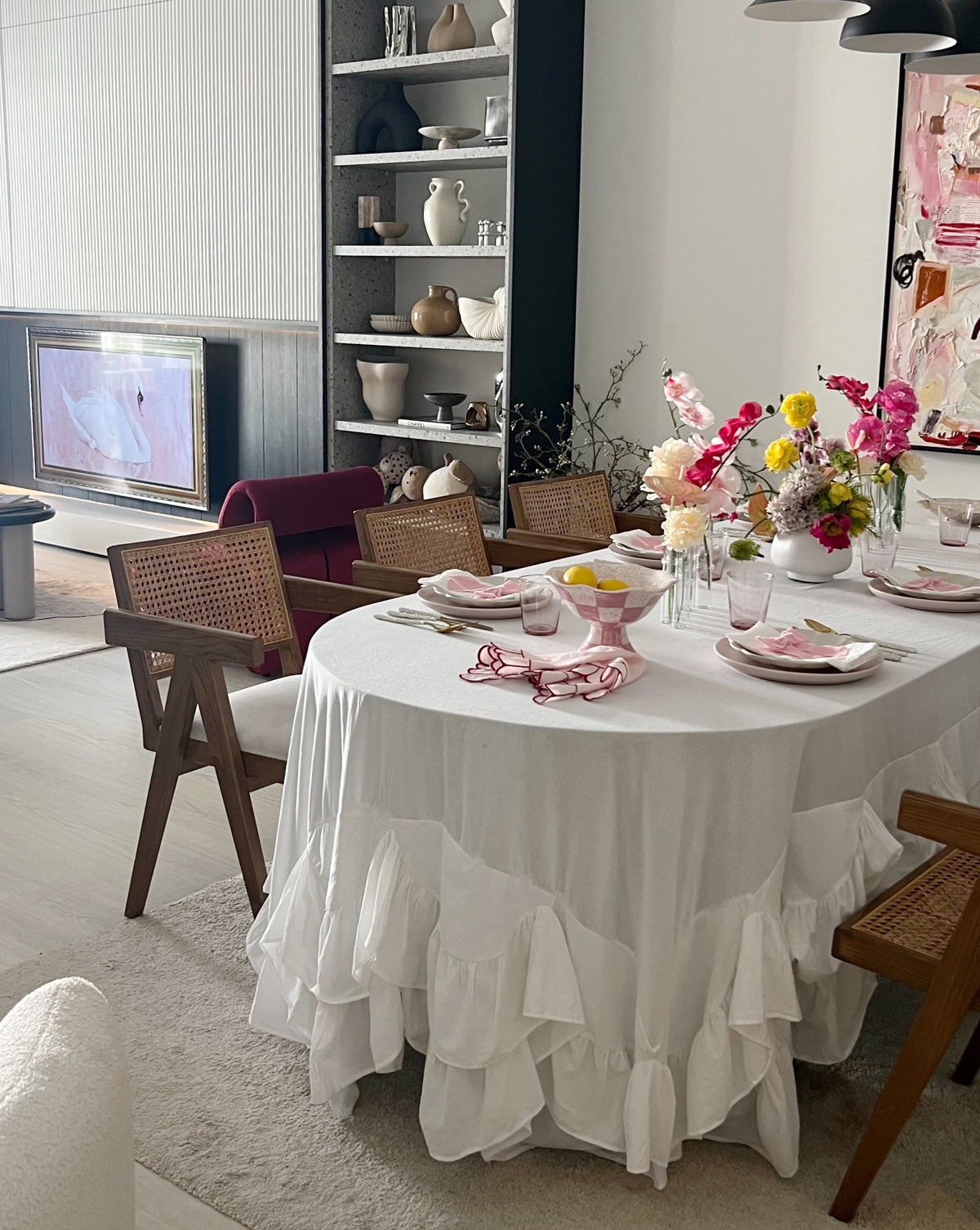 Allegria white Amélie Scalloped Edge Tablecloth showing the deep gathered ruffle skirt drape on a rectangular table