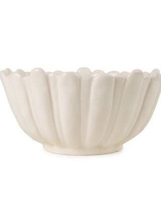 An off-white ceramic bowl with a fluted, scalloped rim, shown against a plain white background.