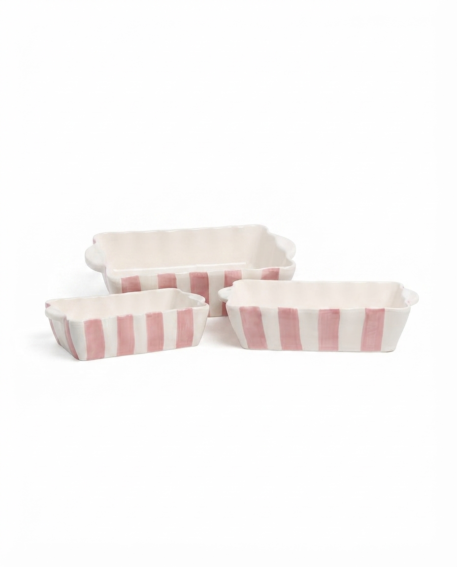 hand painted stripe baker with wavy carry handles on a medium ceramic bakeware dish