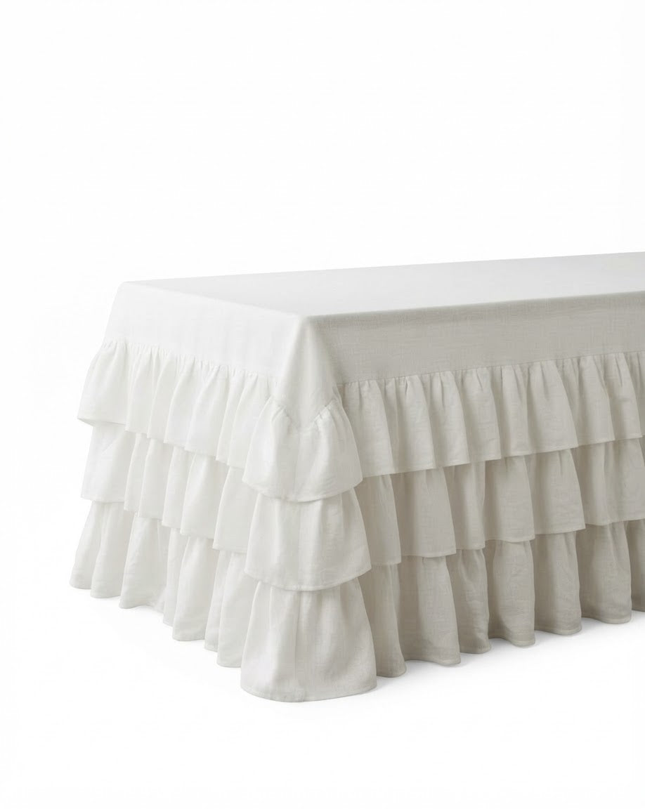 Allegria white The Heirloom 3-Tier Tablecloth showcasing a luxury multi level ruffled linen design pooling gracefully to the floor on a long dining setup
