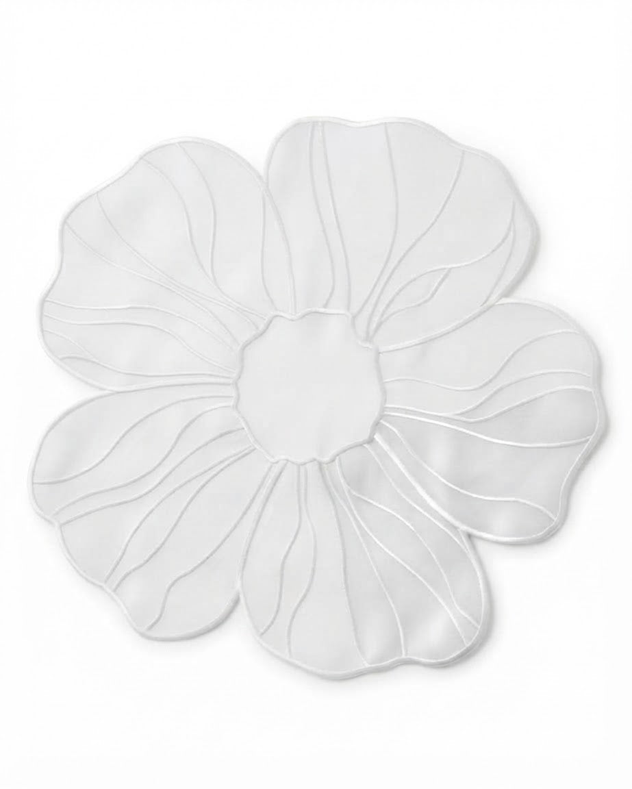 A white fabric flower-shaped placemat with scalloped edges and stitched petal details, displayed on a clean white background.