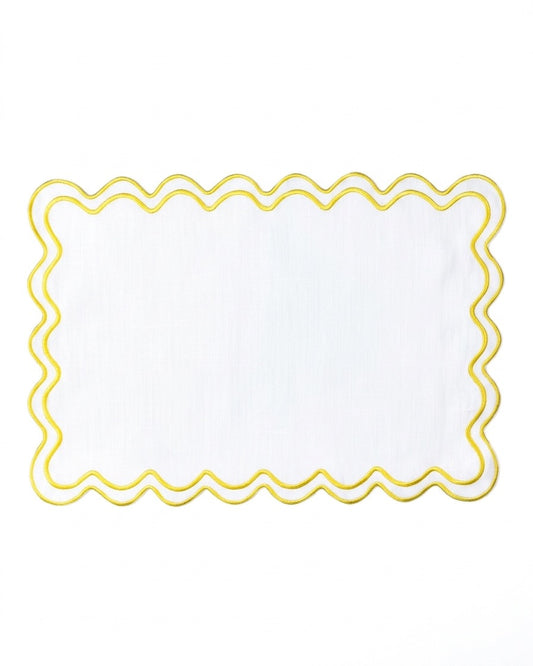 A white rectangular placemat with a scalloped edge and a yellow border, shown flat against a white background.